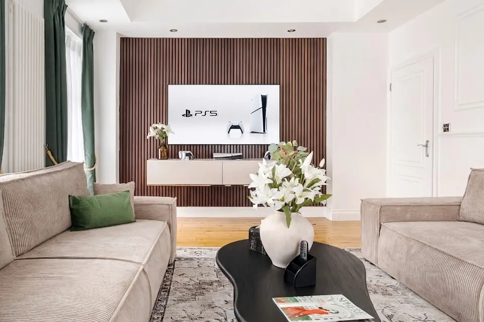 Media wall in walnut slats