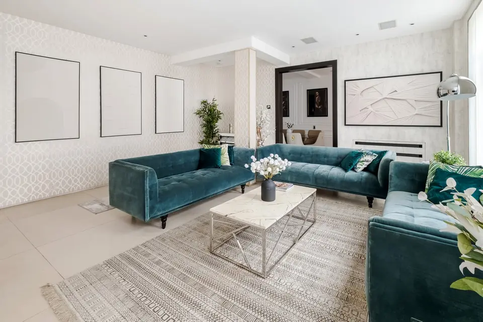 Drawing room with teal velvet sofas
